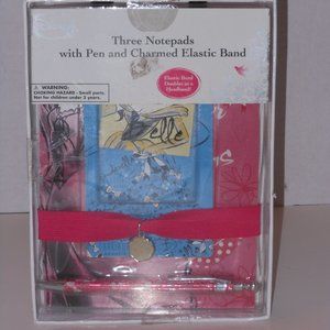 THREE NOTEPADS WITH PEN AND CHARMED ELASTIC BAND